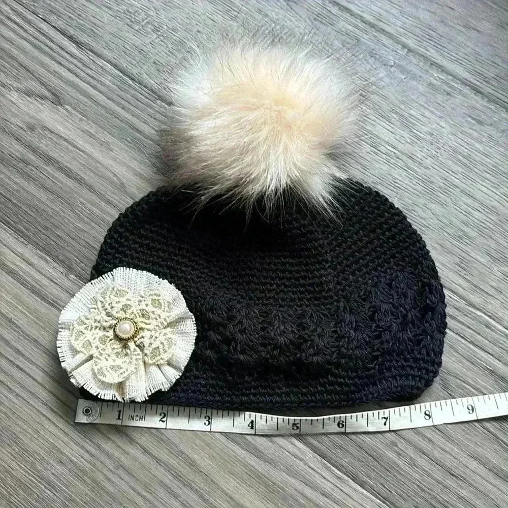 Hand crafted black crochet girls hat with flower and fuzzy pom pom - Picture 6 of 9